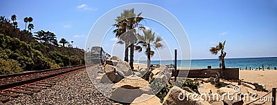 Train moves along tracks that run through San Clemente State Beach Editorial Stock Photo